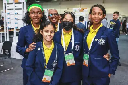 Fourteen-year-old Queen’s College student Aditi Joshi (second left) is distinguishing herself at the Chess Olympiad. Joshi has scored victories over some higher ranked competitors making her eligible for a chess title. (Photo courtesy of the Guyana Chess Federation)