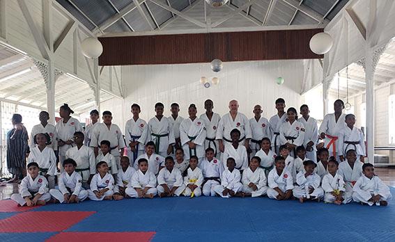 Participants pose for a photo following the conclusion of the grading exercise.