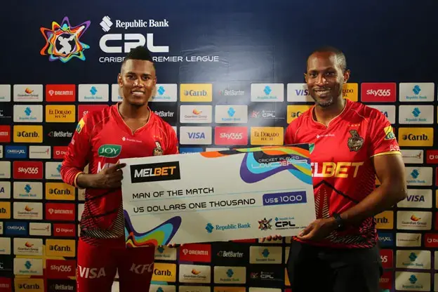 Man of the match, Akeal Hosein (left) of Trinbago Knight Riders collects his award after the Men's 2024 Republic Bank
Caribbean Premier League match between Trinbago Knight Riders and Barbados Royals at Brian Lara Cricket Academy on
September 27, 2024 in Tarouba, Trinidad And Tobago. (Photo by Ashley Allen - CPL T20/CPL T20 via Getty Images)