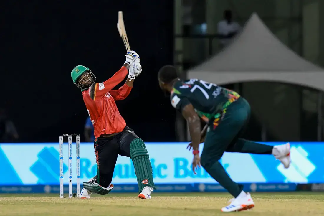 Romario Shepherd (L) of Guyana Amazon Warriors hits 6 off Ryan John (R) of Saint Kitts and Nevis Patriots during the Men’s 2024 Republic Bank Caribbean Premier League match 21 between Guyana Amazon Warriors and Saint Kitts and Nevis Patriots at Guyana National Stadium on September 20, 2024 in Providence, Guyana. (Photo by Randy Brooks/CPL T20 via Getty Images)