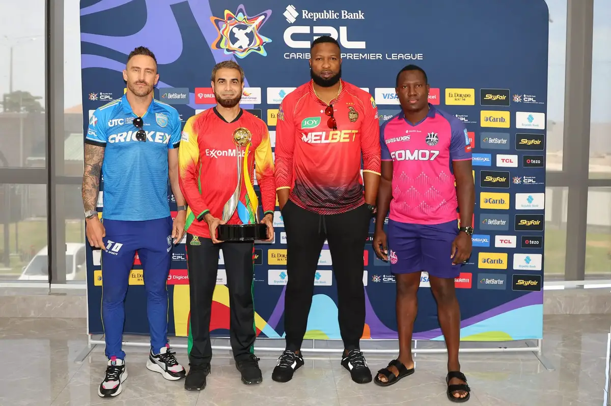 L-R: St. Lucia Kings Faf du Plessis, Guyana Amazon Warriors’ Imran Tahir, Trinbago Knightriders Kieran Pollard and Barbados Royals Rovman Powell posed with the Republic Bank CPL trophy before the playoffs which are slated to get underway today with Barbados facing TKR in the Eliminator. 