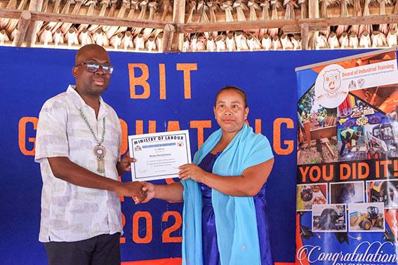 A certificate being handed over by BIT Chief Executive Officer Richard Maughn (left) (Ministry of Labour photo)