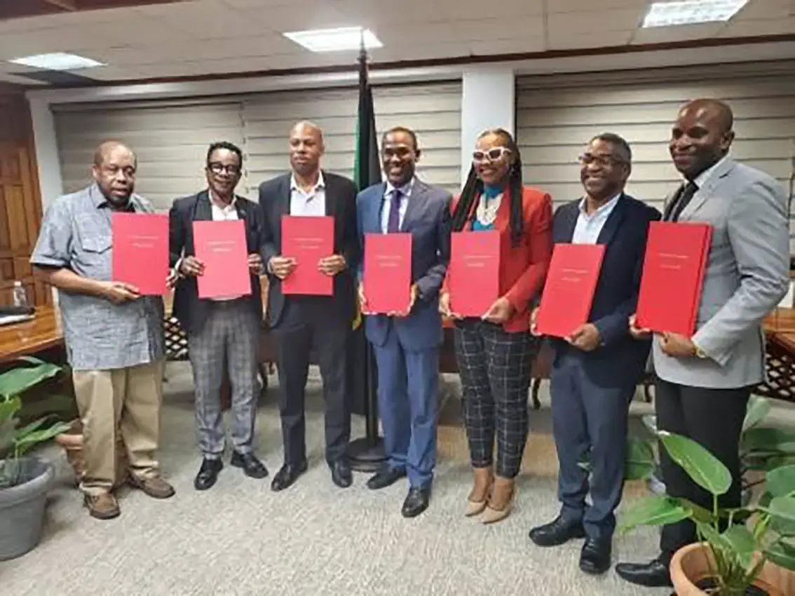 Finance Minister Dr Nigel Clarke (centre) and member unions of the Jamaica Confederation of Trade Unions inked the long negotiated public sector compensation restructuring agreement on Thursday.