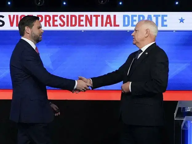 J D Vance (left) and Tim Walz began their US vice presidential debate with a polite handshake. Photo: AP PHOTO