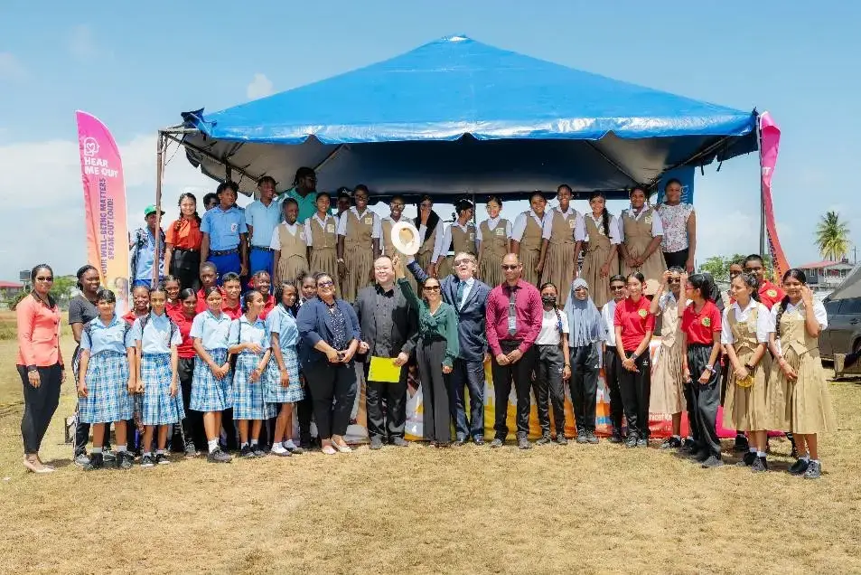 First Lady Arya Ali (centre) with UNICEF, PAHO, WHO and Ministry of Health representatives,  along with students at the Hear Me Out campaign launch