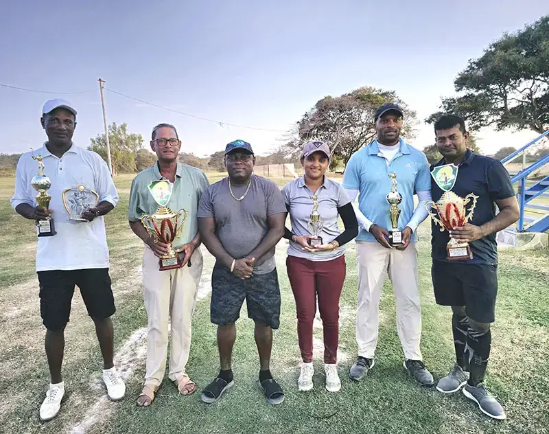 The respective winners in the Atlas Security Service Golf
Tournament pose with their spoils following the conclusion of the event.