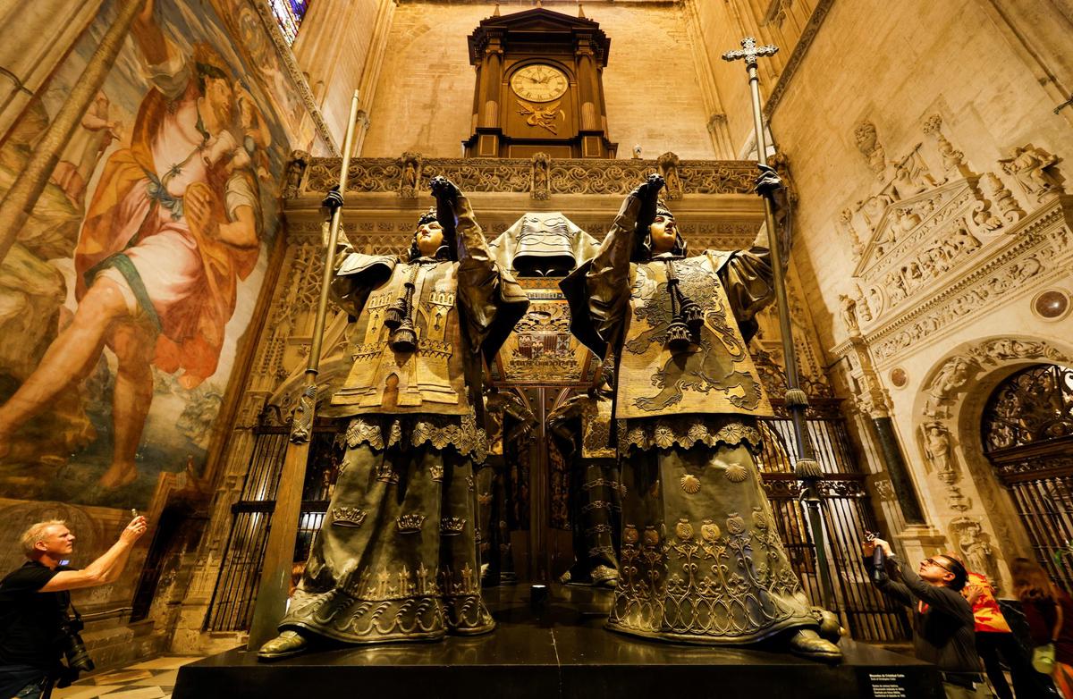 People visit the mausoleum of Christopher Columbus in the cathedral of Seville, Spain, October 11, 2024. REUTERS/Marcelo del Pozo