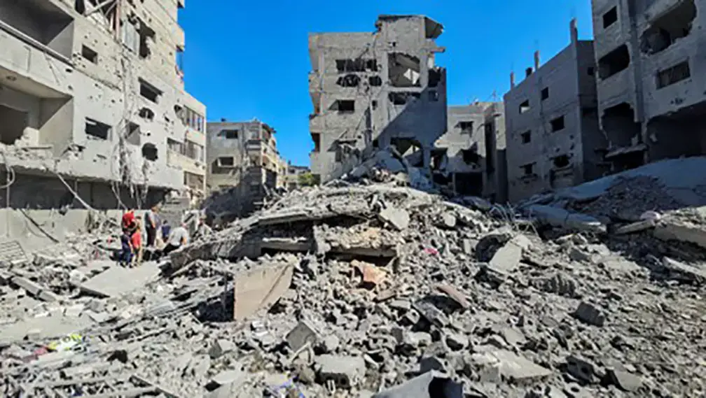 Palestinians gather at the site of Israeli strikes on houses and residential buildings, amid the ongoing Israel-Hamas conflict, in Beit Lahiya, in the northern Gaza Strip October 20, 2024.