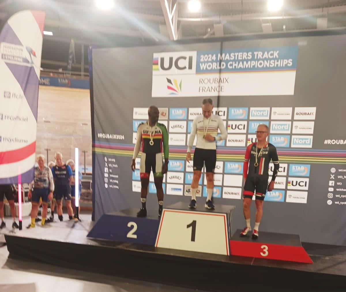 Guyana’s James Joseph (left) stands on the podium at the UCI World Masters Championship in France. He won Silver in the Men’s
Over-50 5000km Scratch Race, Luc Nouwen of Belgium (centre) won gold while Great Britain’s Graham Barclay (right) settled for silver.