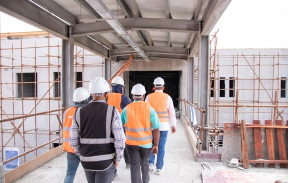 A view of Minister of Health Dr Frank Anthony and others touring the Lima Regional Hospital site