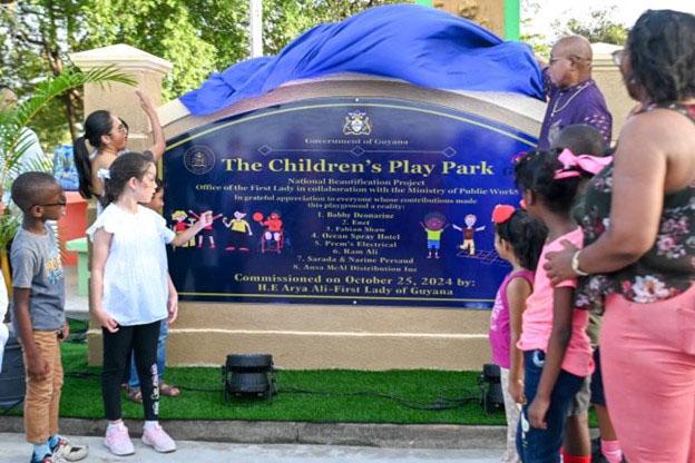 First Lady Arya Ali and Minister of Public Works, Juan Edghill unveiling the sign for the newly commissioned playpark (DPI photo)