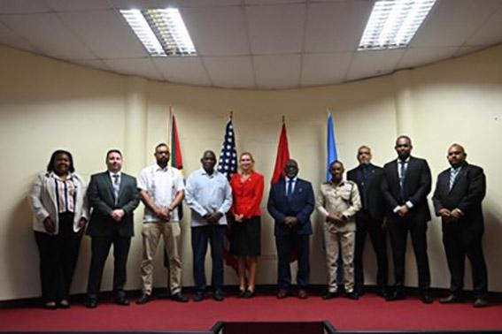 Minister of Home Affairs, Robeson Benn (4th left); US Ambassador to Guyana, Nicole Theriot (centre), Commissioner of Police, Clifton Hicken (4th right), and Crime Chief Wendell Blanhum (2nd right), pose for a photo at the opening of the CARICOM Crime Gun Intelligence Unit (CGIU) sensitisation and awareness workshop in Guyana