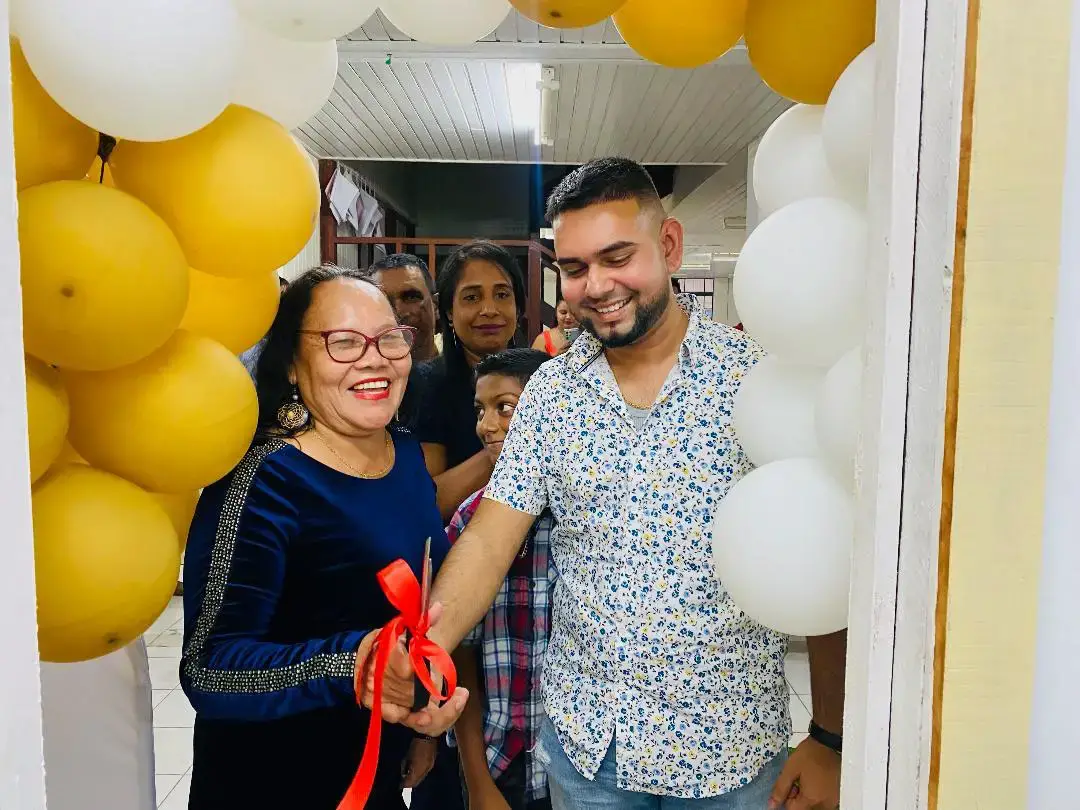 Avishkar Deonarine and Acting Mayor Lorna Fitzallen cutting the ribbon