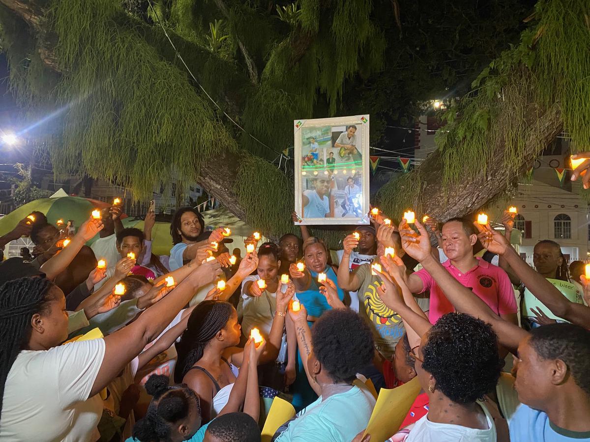 Family and friends holding up their candles