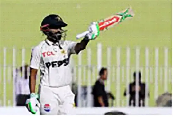 Pakistan's Saud Shakeel
celebrates after reaching his
century REUTERS/Akhtar Soomro