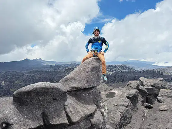 Charlie Bicknell sitting on the Dragon Fortress,