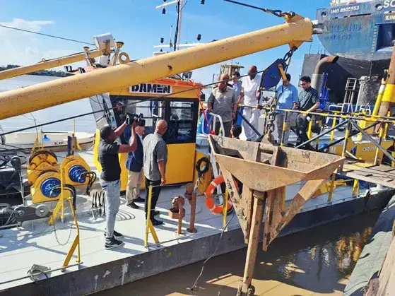 Officials on  a walkthrough of the cutter suction dredger