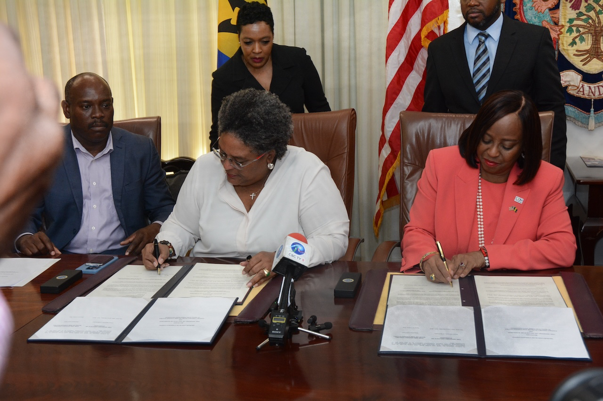 Prime Minister Mia Amor Mottley (centre) and USExim Bank Chairwoman Reta Jo Lewis (right)