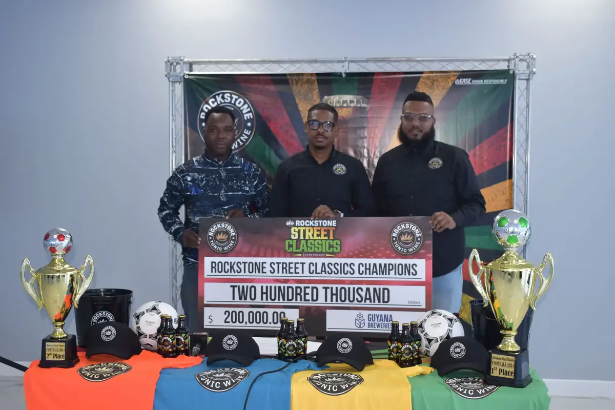 Tournament Coordinator Esan Griffith (left), Seweon McGarrell (centre), Marketing Manager of Guyana Brewery, and Mikhail DaSilva, Guyana Brewery Trade and Marketing Executive, pose for the cameras following the launch of the inaugural Rockstone Street-ball Classic.