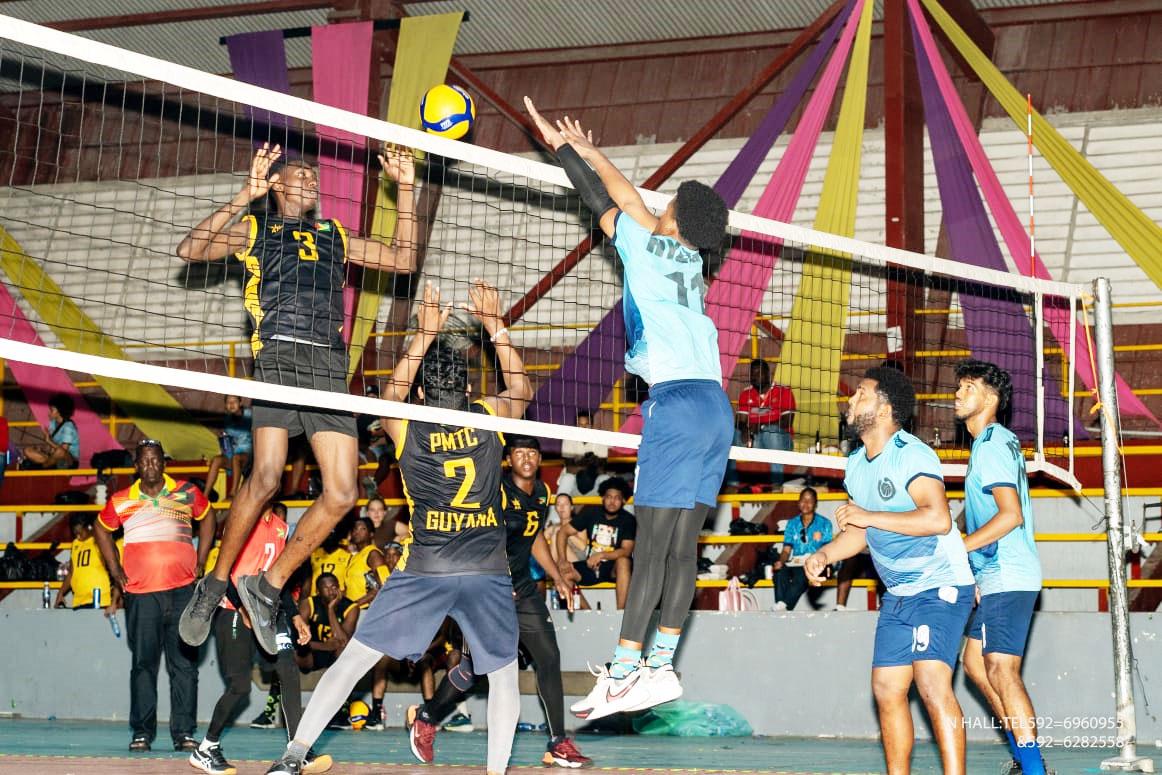 In this photo, a Hydras player (right side of net) rises to attempt a block in their final against PMTC