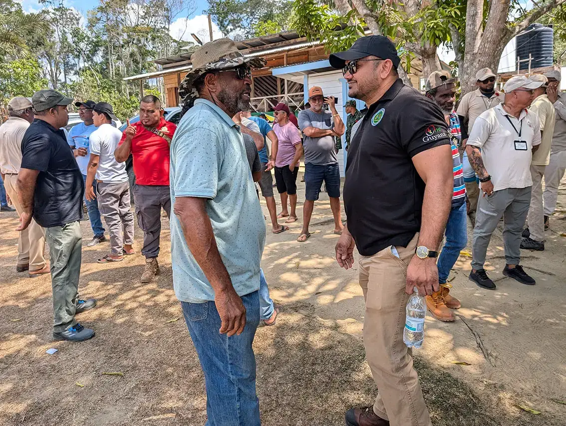 Minister of Natural Resources Vickram Bharrat (right) meeting with members of the Rupununi Miners Association at Bush Mouth on November 8th in the aftermath of the raid by a Brazilian gang (Ministry of Natural Resources photo)