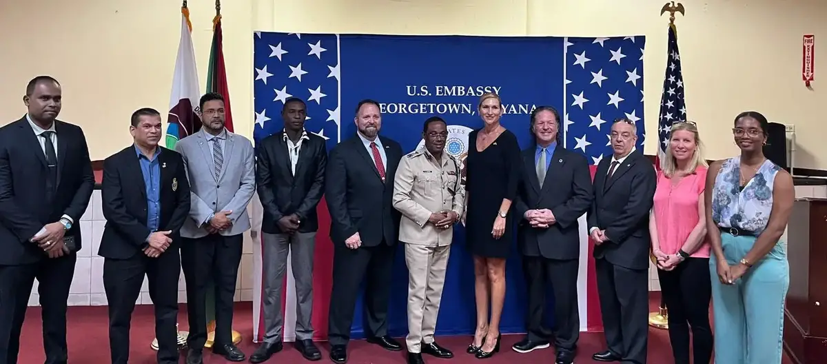 US Ambassador to Guyana, Nicole Theriot (fifth from right) with local and DEA representatives. (US Embassy photo)