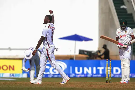 Jayden Seales celebrates after bowling Nahid Rana for 0 (ESPN Cricinfo Photo).