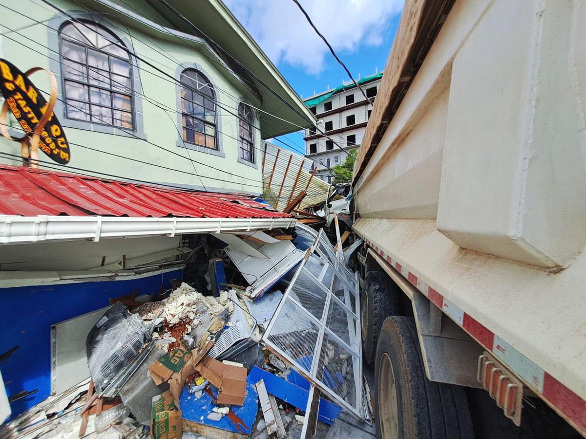 The photo shows the out-of-control truck embedded in the Greenhouse apartment complex