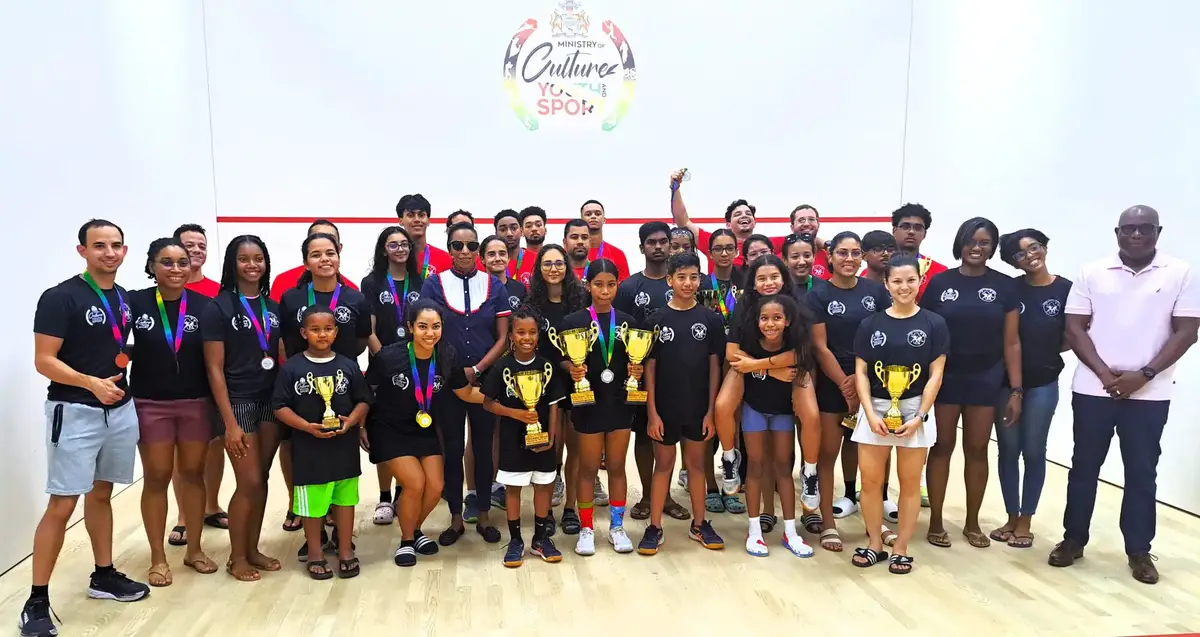 The respective divisional winners and top three finishers pose with their spoils following the conclusion of the President's Cup Squash Championship