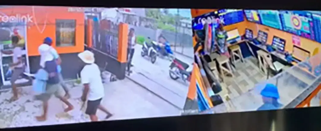 The five attackers seen here in a surveillance camera screen-shot about to enter the business place