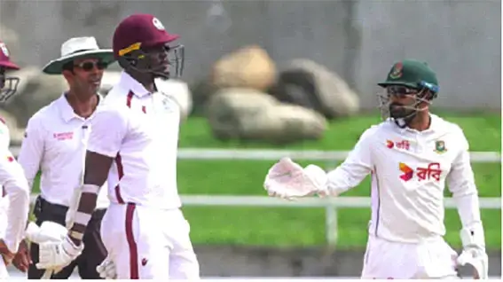 Umpire Kumar Dharmasena observes one of many engagements between the two sides on day three  (Athelstan Bellamy)