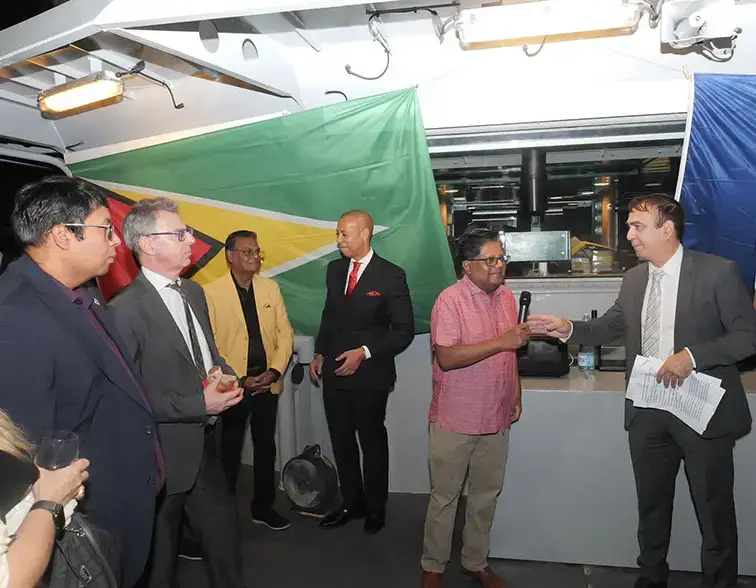 Head of the French Diplomatic Bureau in Guyana Jean-Jacques Forté (right) and Finance Minister Dr Ashni Singh (second from right) at the reception on Saturday. (Ministry of Finance photo)