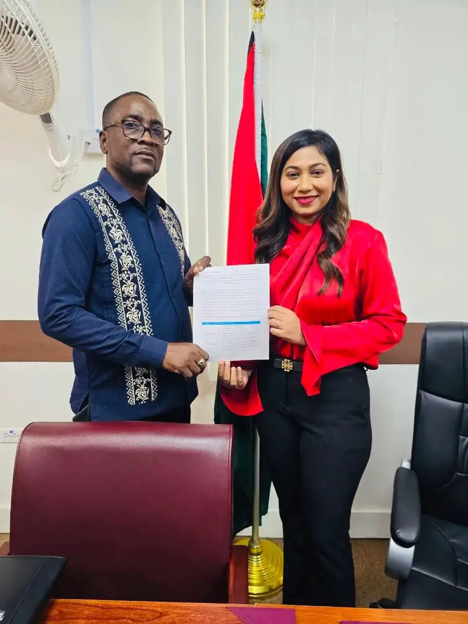 GTU President Mark Lyte and Permanent Secretary of the Ministry of Education Shanielle Hossein-Outar with the signed agreements on August 21. (Ministry of Education photo)