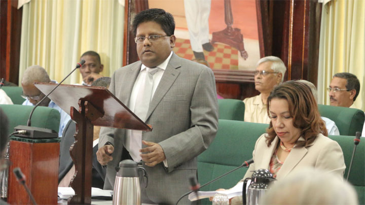 Finance Minister Dr Ashni Singh reading the 2014 national budget ...